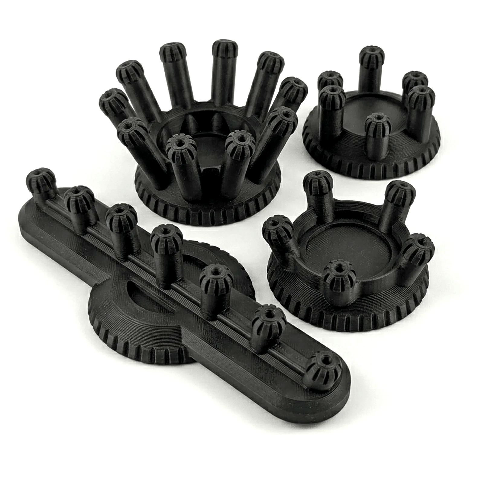 Set of black plastic components on a white background