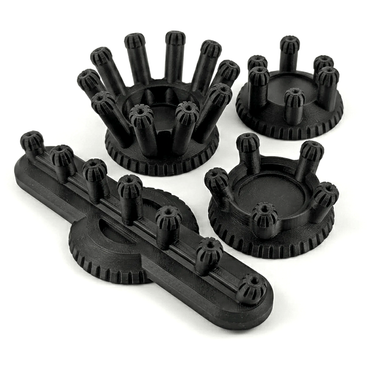 Set of black plastic components on a white background